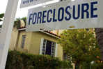 phoenix foreclosures advertised on a real estate sign