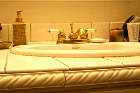 Bathroom sink at the beginning of the home bathroom remodel