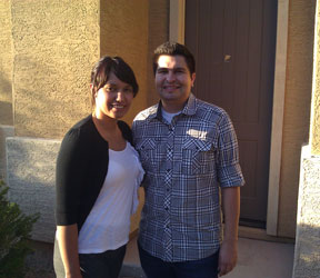 picture of a Phoenix husband and wife standing in front of their new home who recommend Phoenix Real Estate Agents Kristina and Ron Wilczek