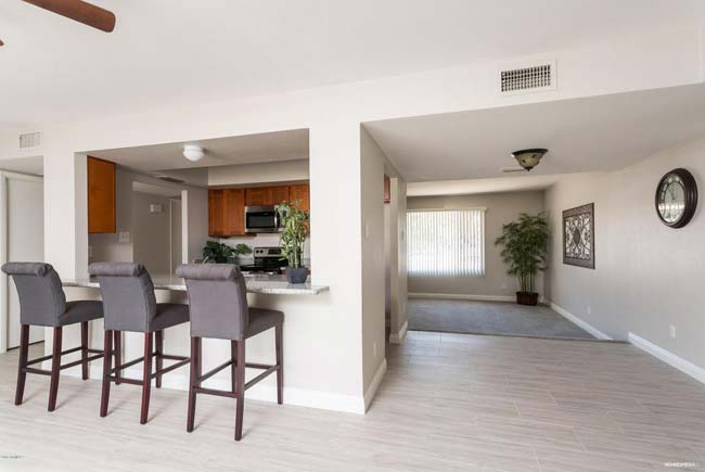 Tempe Arizona home showing kitchen, family room, and living room purchased with help of real estate agents in Tempe AZ